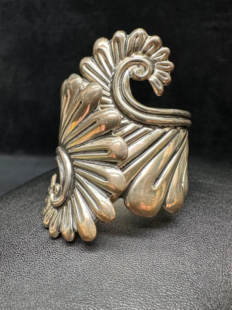 Large Hinged Ornate Sterling Cuff Bracelet B: This piece of jewelry has been tested and researched prior to listing. Please view all our pictures they are part of our description. DETAILS: Metal - Sterling SilverColor - SilverStones -
