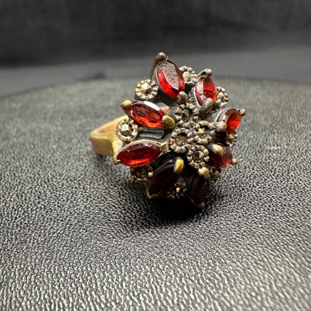 Sterling Marcasite Garnet Starburst RIng: This piece of jewelry has been tested and researched prior to listing. Please view all our pictures they are part of our description. DETAILS: Metal - Sterling SilverColor - SilverStones - Garnet,