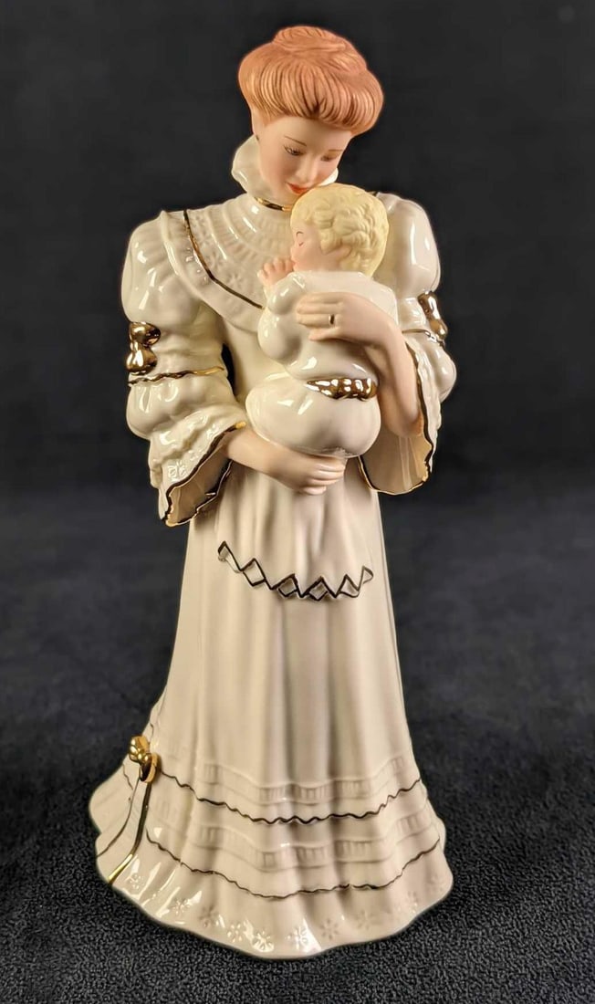 Retired Lenox A Time To Cherish Mother And Child: Retired Lenox "A Time To Cherish" Mother And Child. Was released in 1995. Made of bone china and accented with 24kt. gold. Is approx 4 1/4" x 3 1/4" x 9" and is in a good, used condition with som