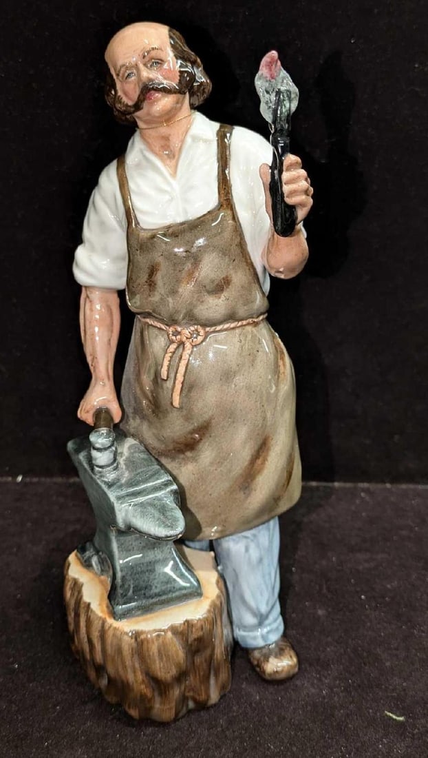 Retired Royal Doulton Blacksmith Figurine: Retired Royal Doulton Blacksmith Figurine. This is approx 3 3/4" x 3 1/2" x 8 7/8" and it weighs 1.09lb. This was released from the year 1987 to the year 1991 and was designed by William K.