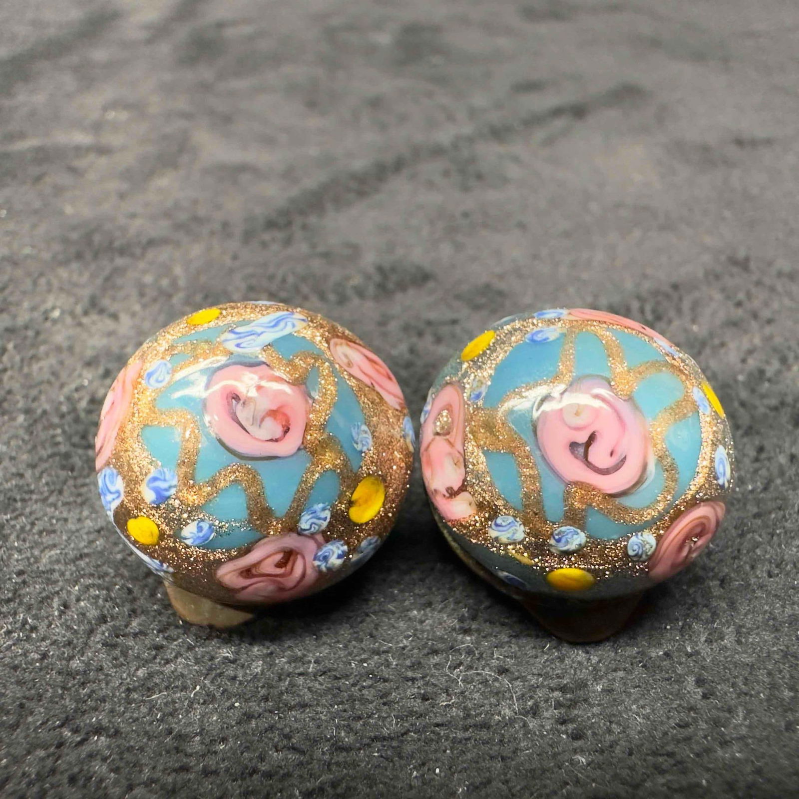 Murano Venetian Art Glass Lamp Work Blue Floral Fiorato Round Bead Earrings D41: Murano Venetian Art Glass Lamp Work Blue Floral Fiorato Round Bead Earrings D41. Earrings with blue colored glass beads with beautiful hand painted designs on each. The earrings feature floral and cop