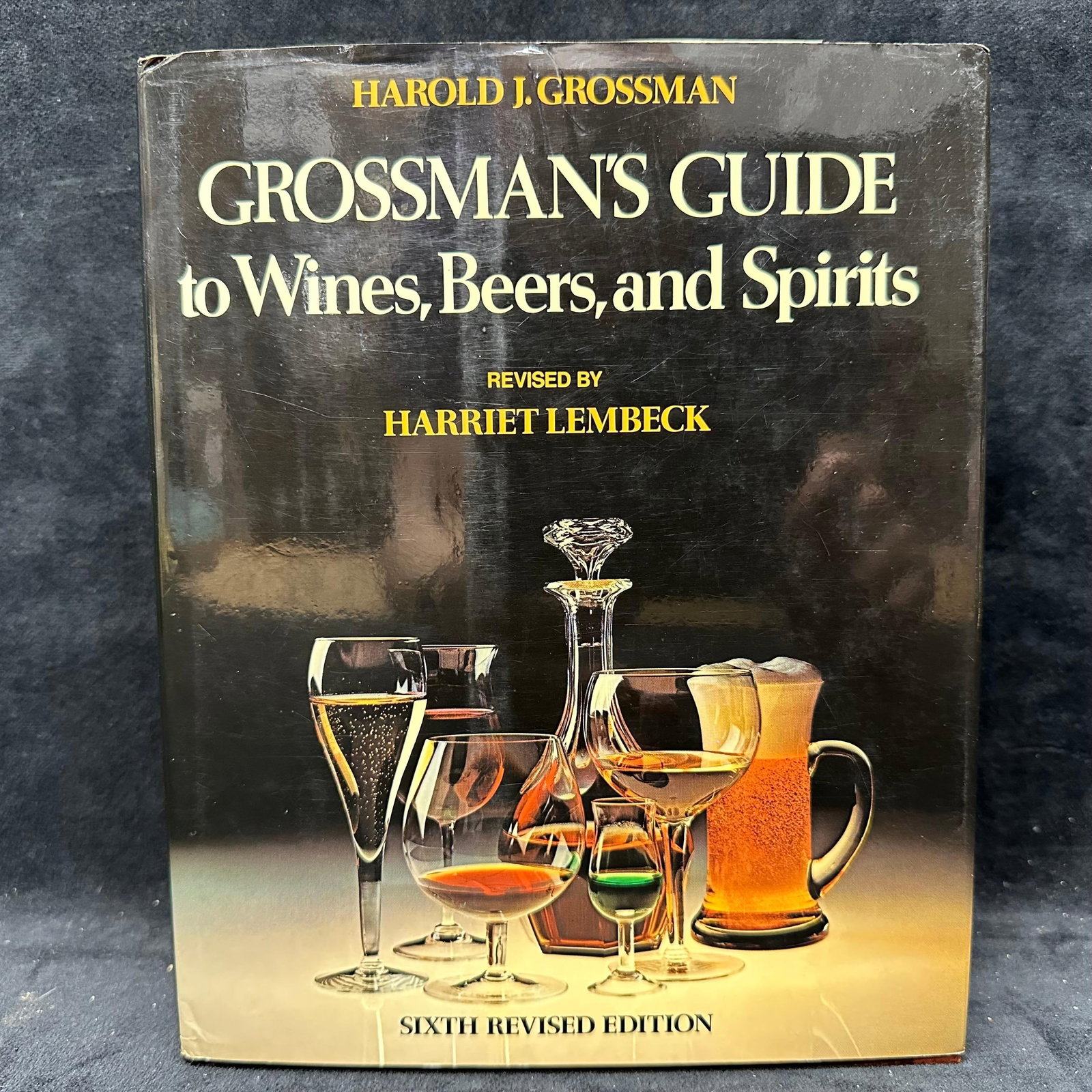 Grossman's Guide to Wines Beers and Spirits Hardcover Signed Harriet Lembeck Personalized Letter: Signed by Harriet Lembeck with a personal inscription to Michel Roux. Includes a formal personalized letter inscription signed by Lembeck. Condition shows general handling wear, scuffing, and surface