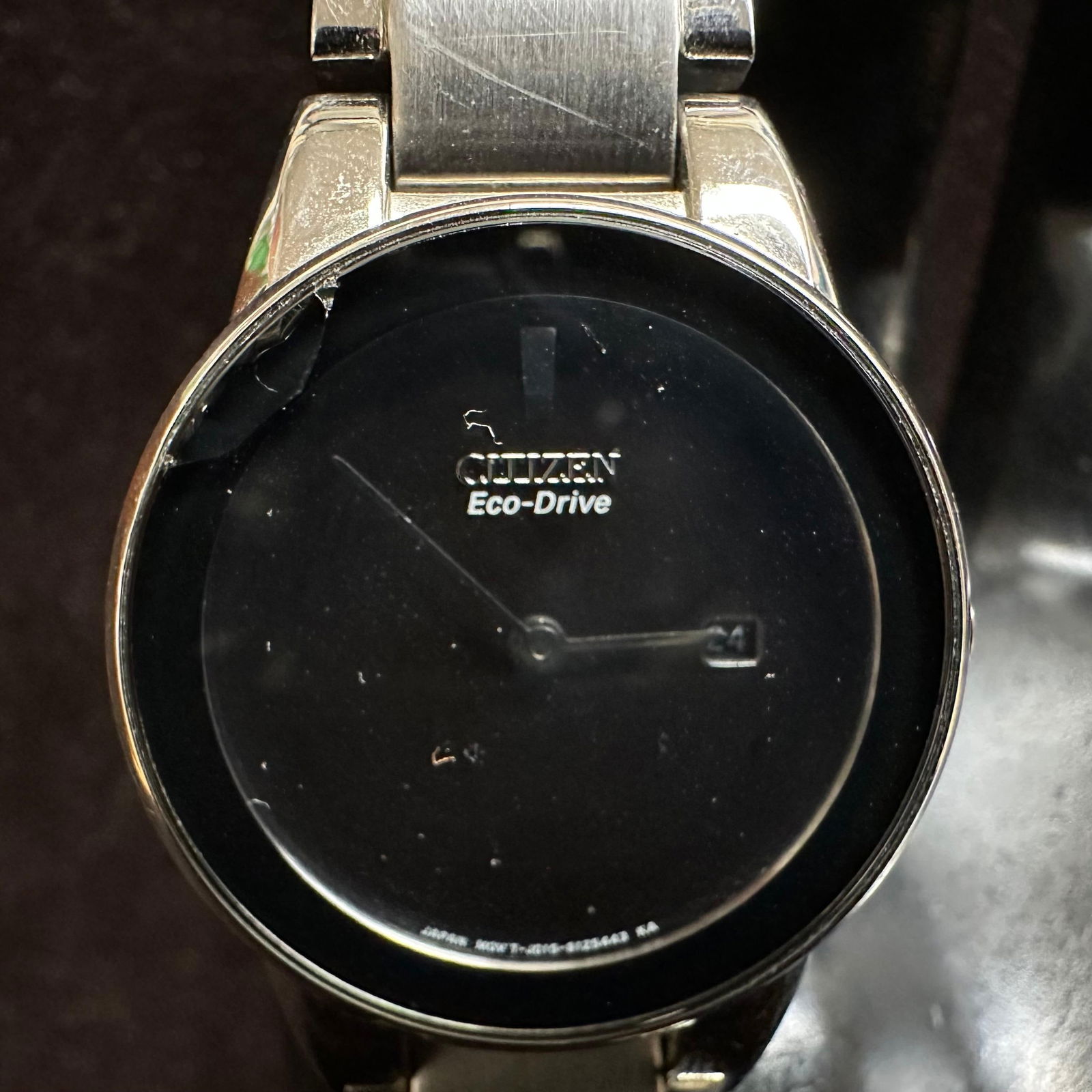 Citizen Eco-Drive Stainless Steel Wristwatch Black Dial Broken Band: Citizen Eco-Drive wristwatch featuring a black dial with date window, stainless steel case and bracelet, and Eco-Drive movement. Marked Japan movement. Water resistant. Watch shows surface wear and