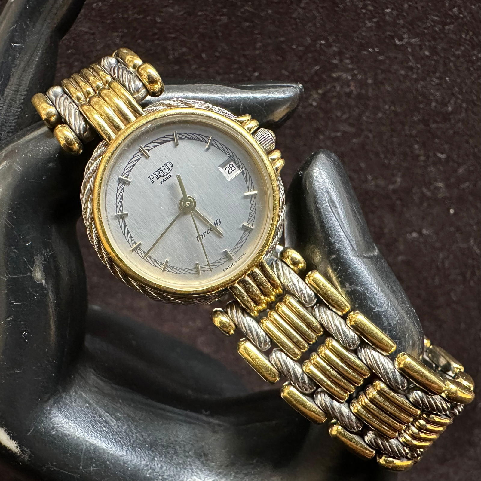Fred Paris Force 10 Watch Swiss Quartz Two-Tone Stainless Steel Wristwatch: Fred Paris Force 10 wristwatch featuring a silver dial with rope-style chapter ring, applied hour markers, date window at 3 o’clock, and quartz movement. The watch is fitted with a two-tone