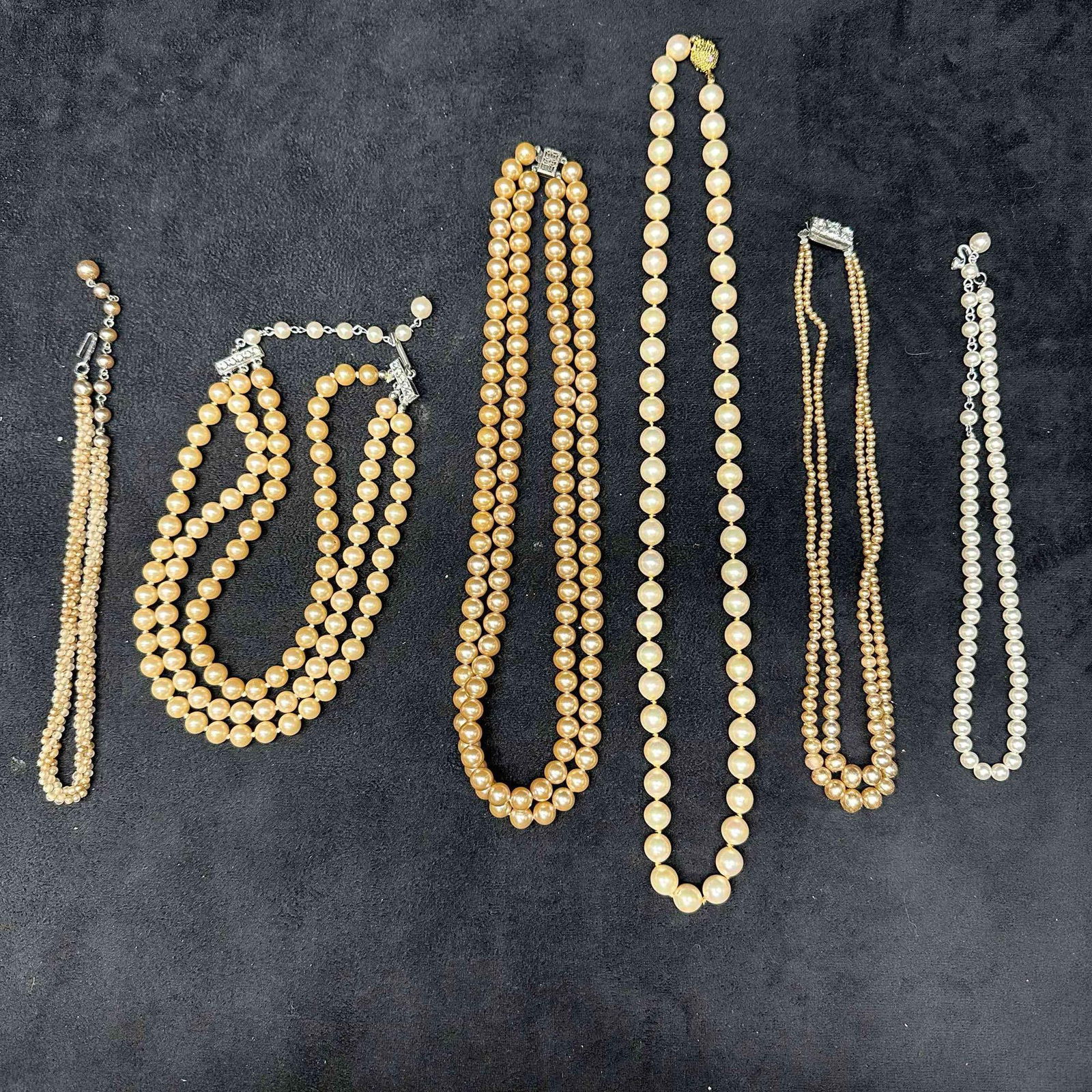 Costume Jewelry Necklaces Faux Pearl Beaded Set of Six: Costume Jewelry Necklace Set Various Necklaces Faux Pearl Plastic Beaded Accents. Six necklaces included in this set, with some made of plastic beads and faux pearl accents. Some of the necklaces are