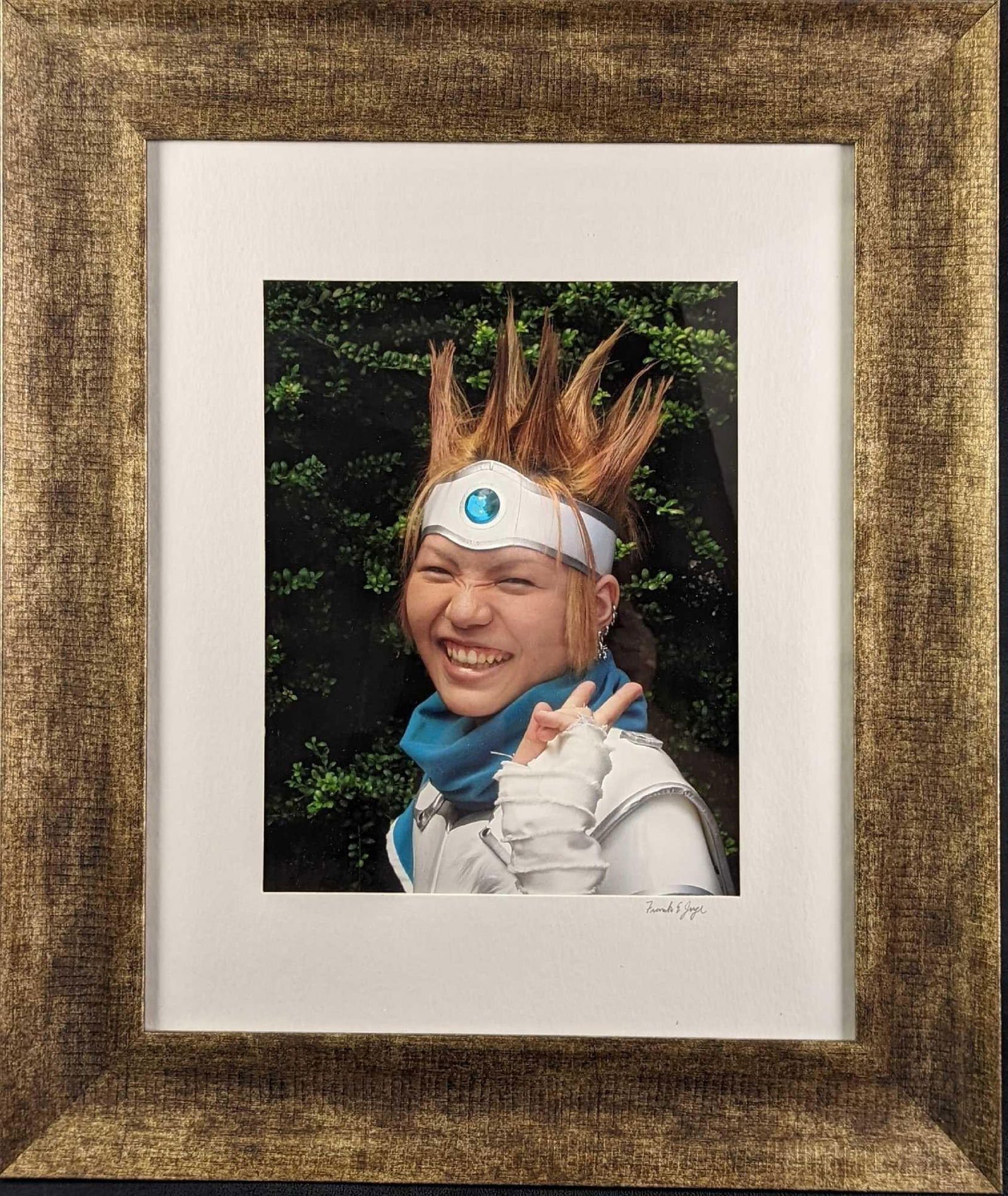 Framed Frank Juge Cosplayer Photo: Framed Frank Juge "Cosplayer" Photo. This is signed by the artist on the bottom right. The framed photo is approx 21 1/2" x 1" x 25 1/2" and it weighs 5lbs. The photo/image is approx 10" x 13 1/2".