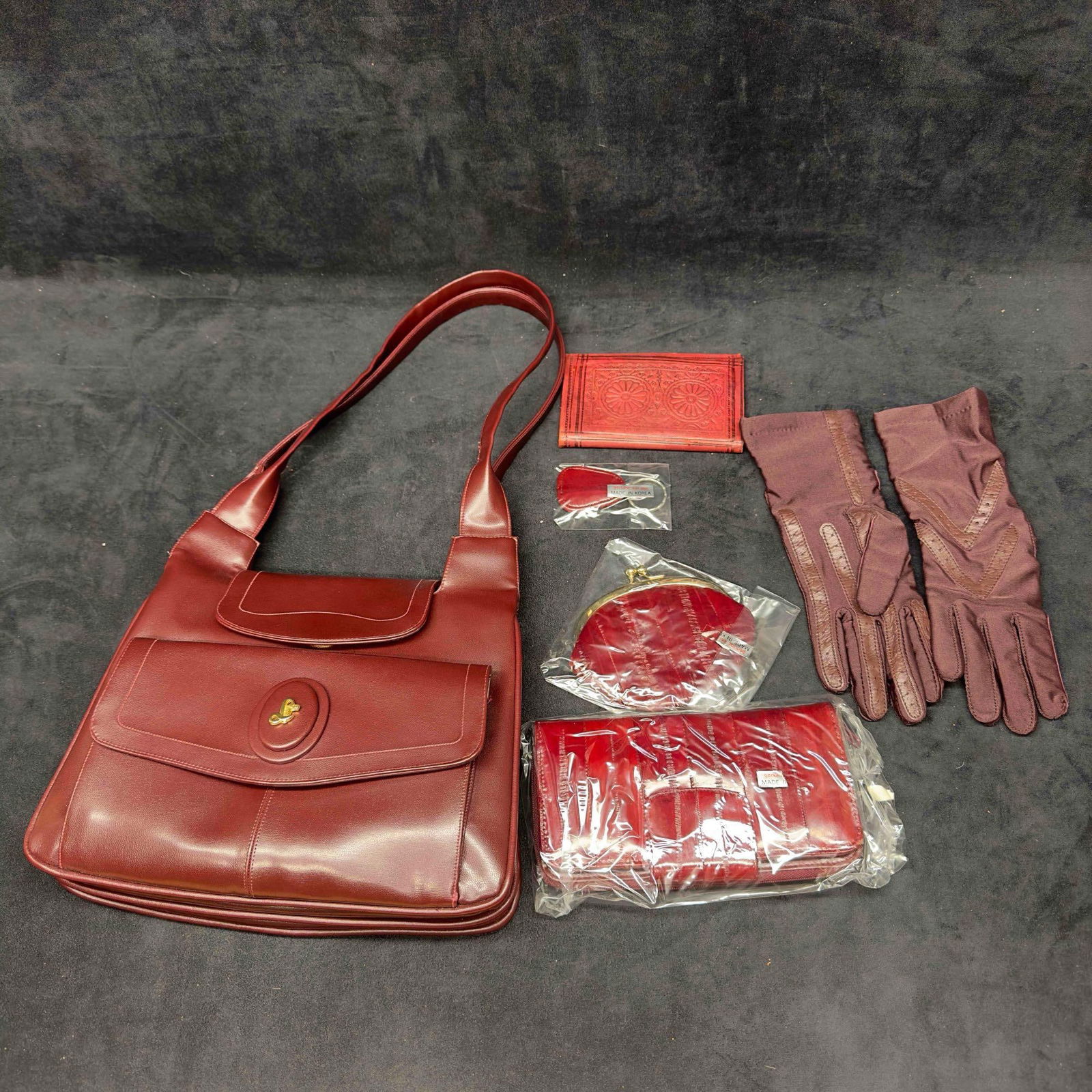 Lou Taylor Accordion Shoulder Bag Maroon Purse Attached Swivel Mirror Eel Skin Accessories Set: Lou Taylor Accordion Shoulder Bag Maroon Purse Attached Swivel Mirror Eel Skin Accessories Set. This set includes genuine eel skin accessories including a key chain, wallet, and coin purse. Also