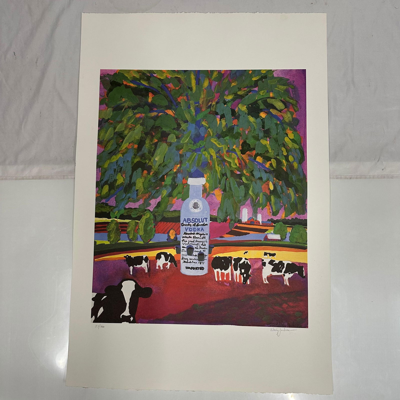 Signed and Numbered Absolut Statehood Vermont Woody Jackson Print 37/400: Limited edition Absolut Vodka “Statehood” lithograph print on paper. Features the iconic Absolut bottle incorporated into a stylized Vermont-themed landscape composition. Hand-signed by