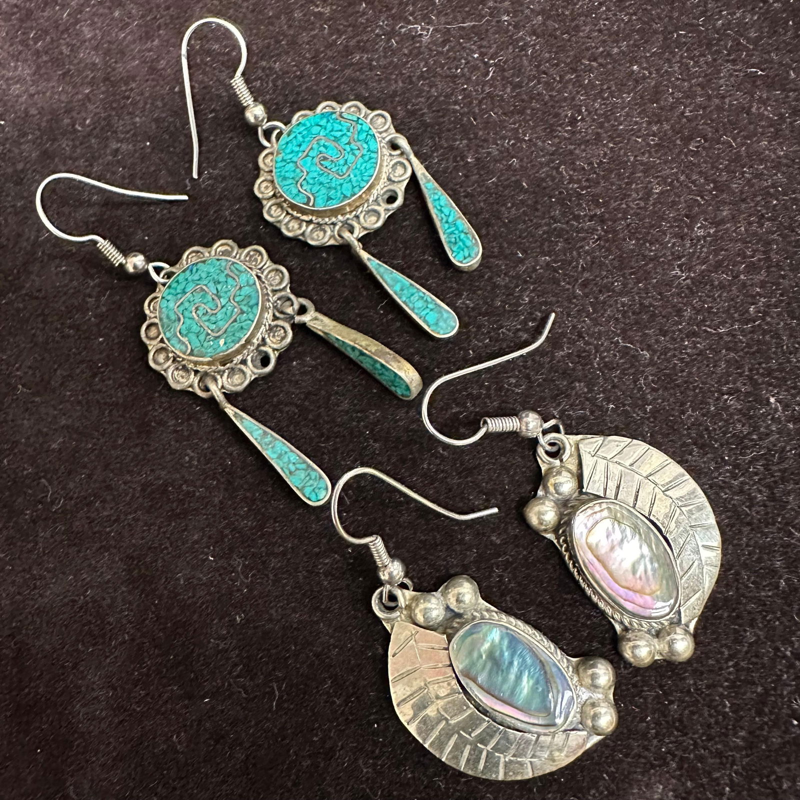 Alpaca Mexico Abalone Shell and Green Stone Dangle Earrings Set: Pair of Southwestern-style dangle earrings featuring oval abalone shell cabochons and green stone composite inlay set in a silver tone setting with accents. Hook backs. Stamped on reverse: Alpaca