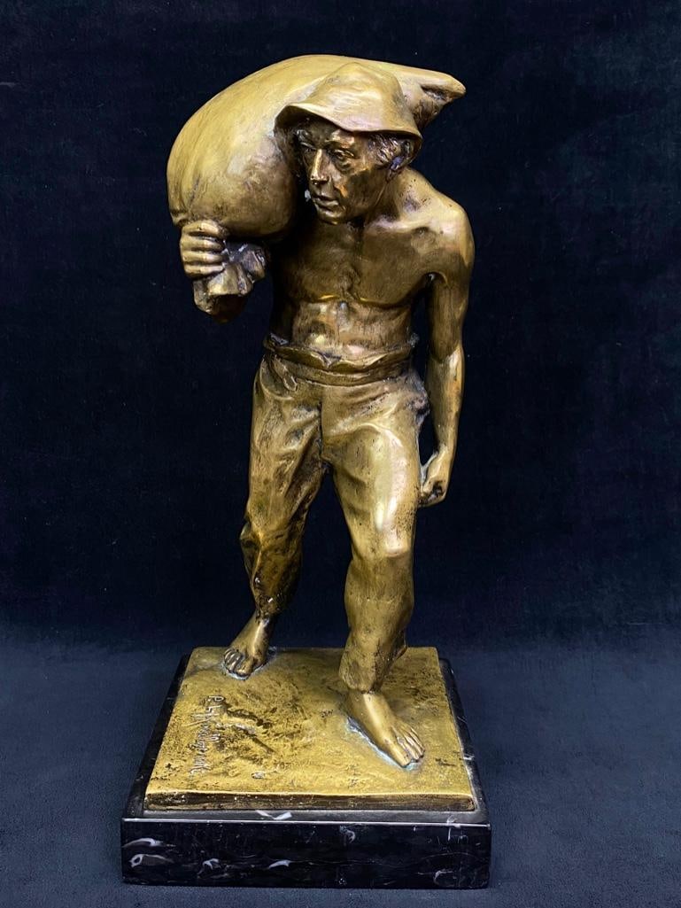 Antique Gilt Bronze Peasant By P. L. Kowalczewski: Antique Gilt Bronze Peasant By P. L. Kowalczewski Gilt bronze statue from the turn of the century by Paul Ludwig Kowalczewski. The piece depicts a shirtless Eastern European peasant carrying a