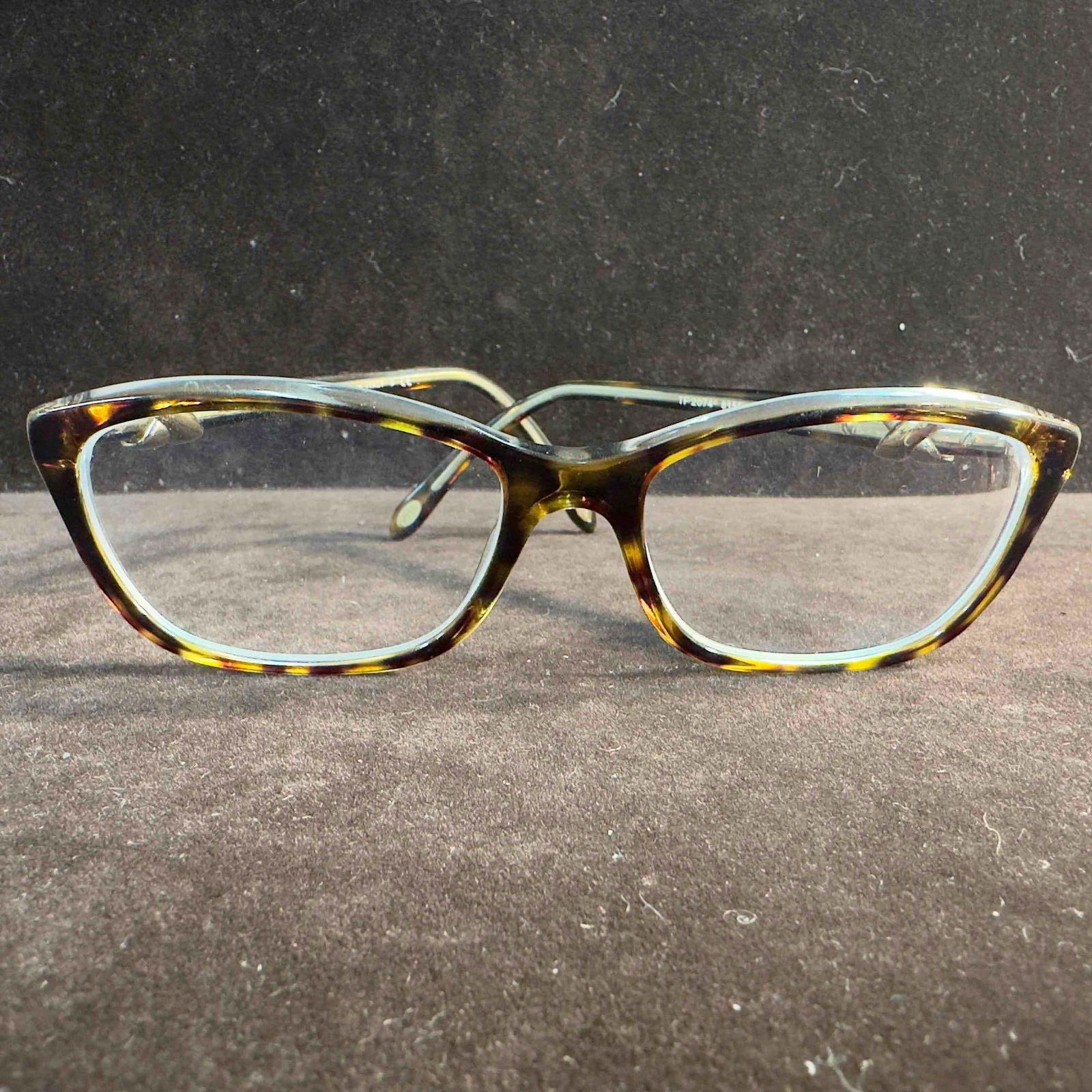 Tiffany & Co TF2074 8155 Havana On Transparent Women's Eyeglasses 52-16-135 #1: Tiffany & Co TF2074 8155 Havana On Transparent Women's Eyeglasses 52-16-135 #1. Tiffany & Co. TF2074 eyeglasses includes the Tiffany & Co. logo on the temple. The polished havana on