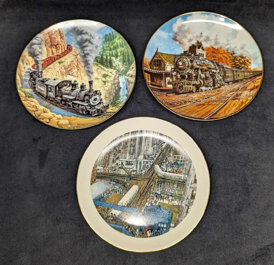 3 Collectable American Train Plates: This lot includes: (1) Limited Edition Chicago Collection - Rush Hour Collectible Plate By Franklin McMahon. This was released in 1978 and is approx 8" x 8" x 3/4". (1) Above The Canon -