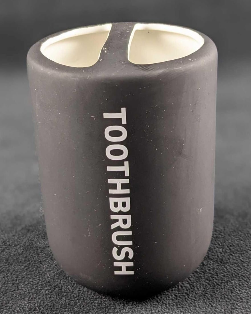 Mainstays Soft Touch Ceramic Toothbrush Holder Black: Introduce a fresh and classic look to your bathroom with the Mainstays Soft Touch Ceramic Toothbrush Holder. The Toothbrush Holder features bold descriptions in white set against a black ground in a