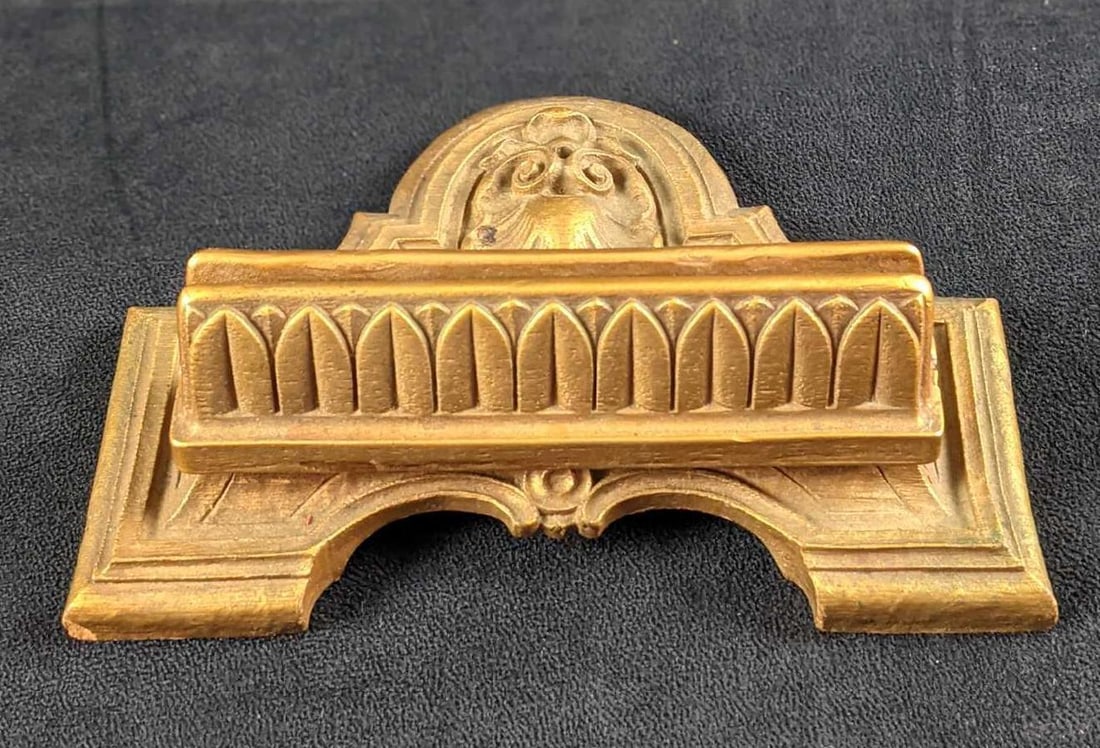 Brass Colored Resin Sign Holder: Brass Colored Resin Sign Holder. Here is a fancy way to show off a sign, which is to place in this holder. Could also be used for placing new mail. Maker and date of creation is unknown. Holder is