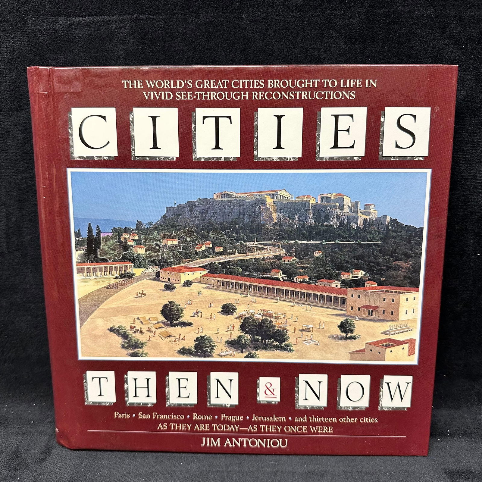 Cities Then and Now by Jim Antoniou Hardcover Book: Hardcover copy of Cities Then & Now by Jim Antoniou, published by Macmillan. This illustrated reference explores the historical development of major world cities through layered then and now