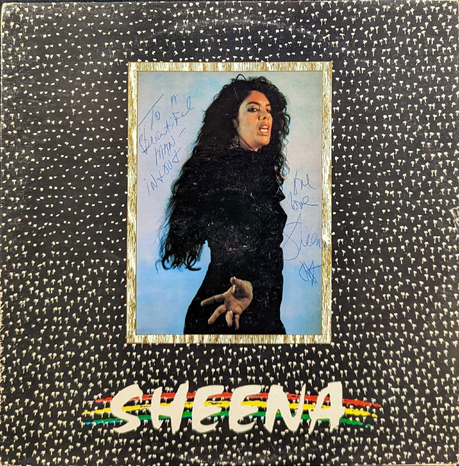 Autographed Sheena Crossfire Selection LP: Autographed Sheena Crossfire Selection LP. This was released by Sure Spin in 1990. Is approx 12 1/4" x 12 1/4" and it weighs 0.48lb. The jacket has some shelf-wear and markings. The record