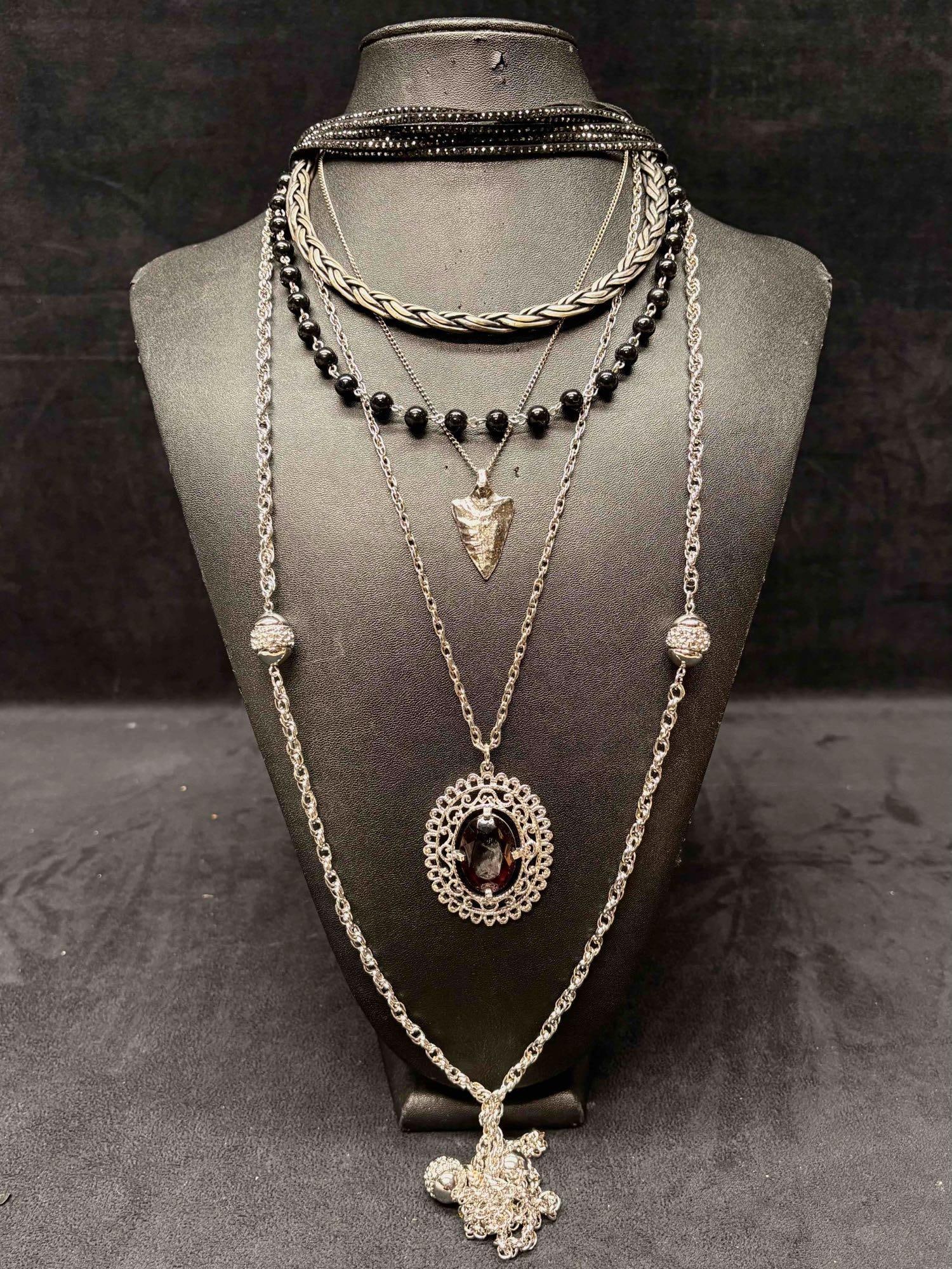 6pc Red Black and Silver Riot Girl Themed Necklace Lot: This lot consists of 6 pre-owned costume jewelry necklaces with typical wear from use. Please review images for context of the lots visual conditions. APPROX. WEIGHT: 6.5 OZ