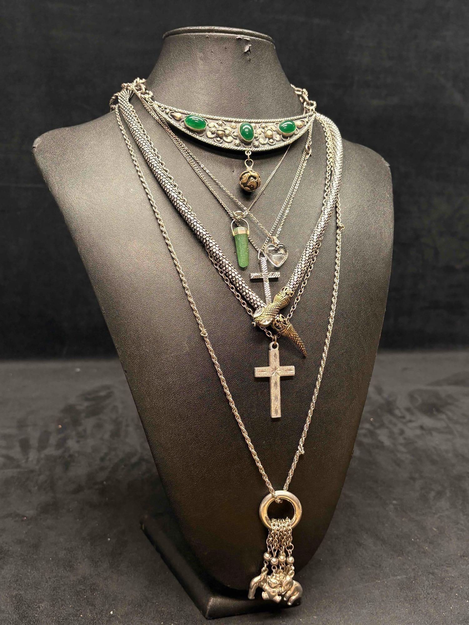 7pc Silver and Green Garden of Eden Themed Necklace Lot: This lot consists of 7 pre-owned costume jewelry necklaces with typical wear from use. Please review images for context of the lots visual conditions. APPROX. WEIGHT: 4.7 OZ