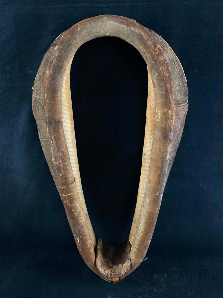 Antique Leather Horse Collar: Antique Leather Horse Collar Horse collar made of leather with fabric padding, from the early 20th century. Used to evenly distribute the load on a horse's chest and shoulders when pulling a