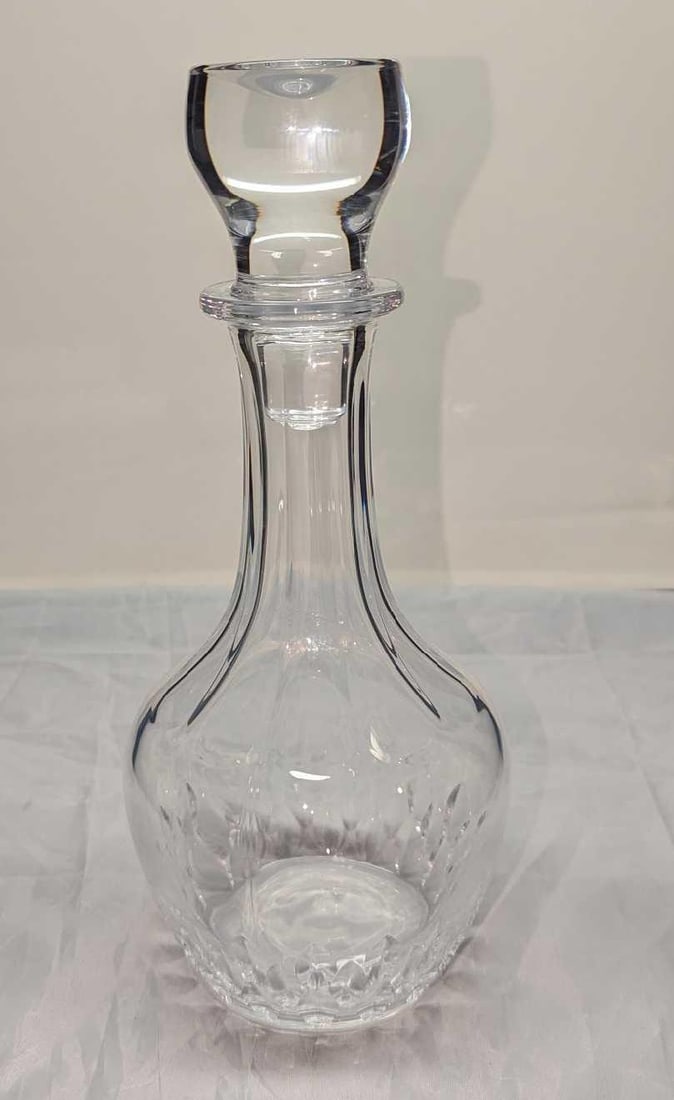 Vintage Clear Glass Decanter With Stopper: Vintage Clear Glass Decanter With Stopper. Its maker and date of creation are unknown. Is approx 5" x 5" x 11" and it weighs 2.61 lbs. The decanter is in a good, vintage condition with no chips or
