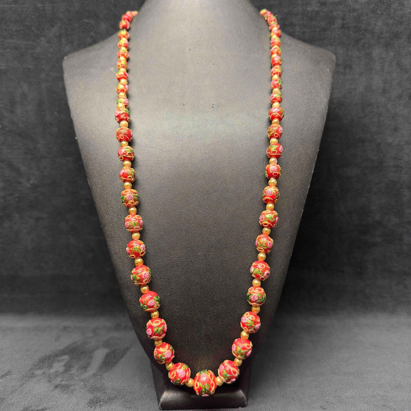 Murano Venetian Lamp Work Art Glass Red Round Gold Floral Beaded Necklace F49: Murano Venetian Lamp Work Art Glass Red Round Gold Floral Beaded Necklace F49. Necklace with red colored glass beads with a beautiful design on each. The necklace features pink floral and gold colored