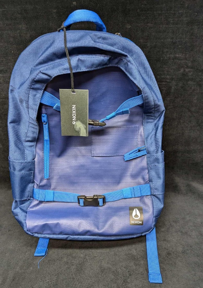 Nixon Smith Backpack: Nixon Smith Backpack. Comes with the original tags. Is missing its mini bag that would be on the right side. This is approx 14" x 4" x 21" and it weighs 1.50 lbs.