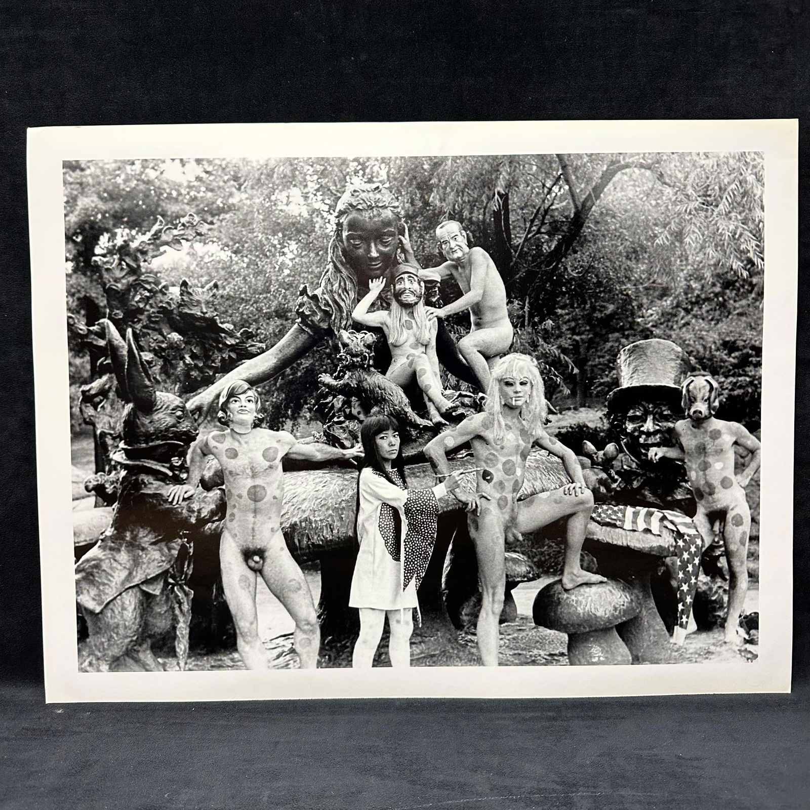 Yayoi Kusama Black and White Large Photo Print Alice In Wonderland Statue: Large black and white photographic print depicting Yayoi Kusama posed with polka-dotted nude models in an outdoor sculptural statue, Alice in Wonderland, setting in New York's Central Park. Print