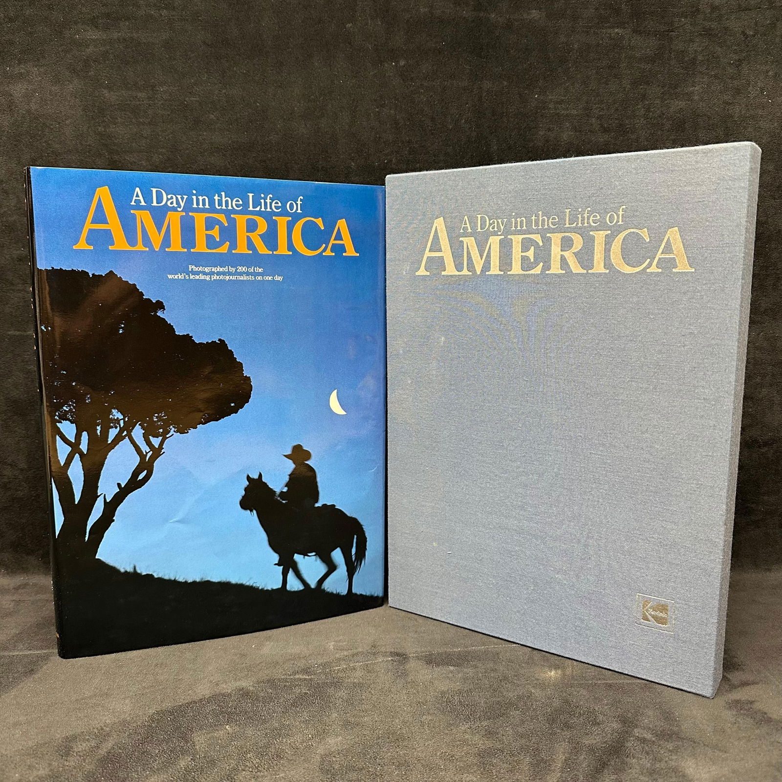 A Day in the Life of America Hardcover Photography Book Kodak with Slipcase: A Day in the Life of America, photographed by 200 of the world’s leading photojournalists on one day, May 2, 1986. Published by Collins Publishers. Large-format hardcover, coffee-table style, with