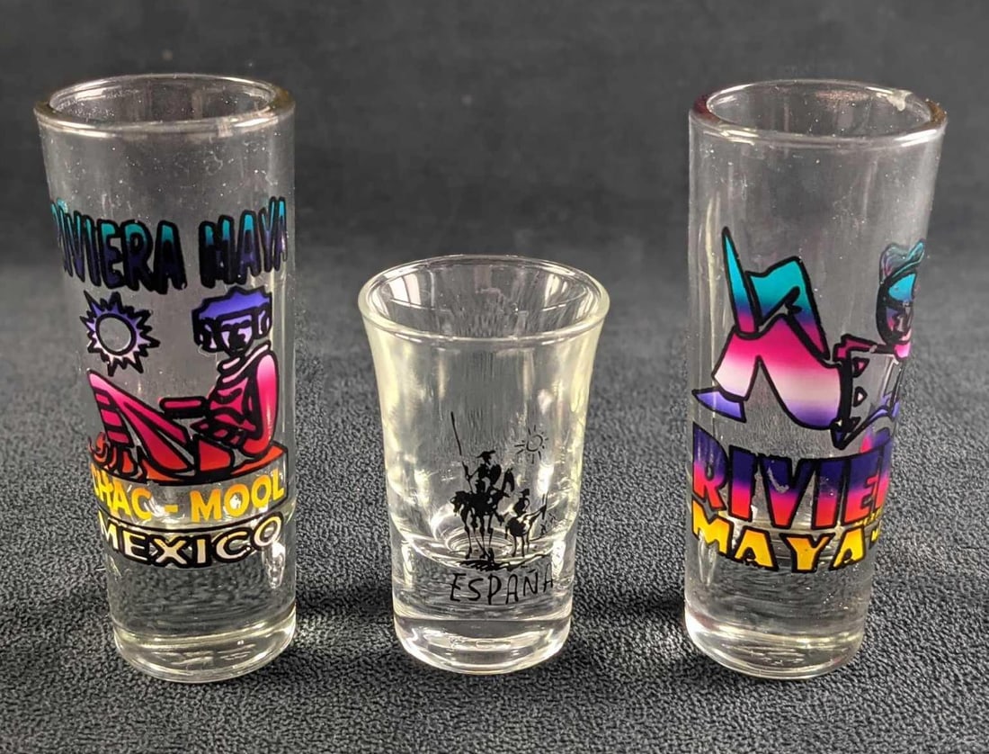 Mexican Souvenir Shooters And Shot Glass: This lot includes: (1) Riviera Maya Mexico Shooter (siesta). This is approx 1 1/2 x 1 1/2" x 4".(1) Riviera Maya Mexico Shooter (statue). This is approx 1 1/2 x 1 1/2" x 4".(1)