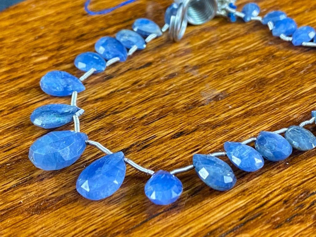 String of Natural Teardrop Sapphire Beads: String of Natural Teardrop Sapphire Beads DETAILS: Metal - noneColor - BlueSize - 3.5 mm - 7mm beads, 7" stringWeight - 0.42 ozMarkings - noneMaker - unknownStones - sapphireStyle - faceted