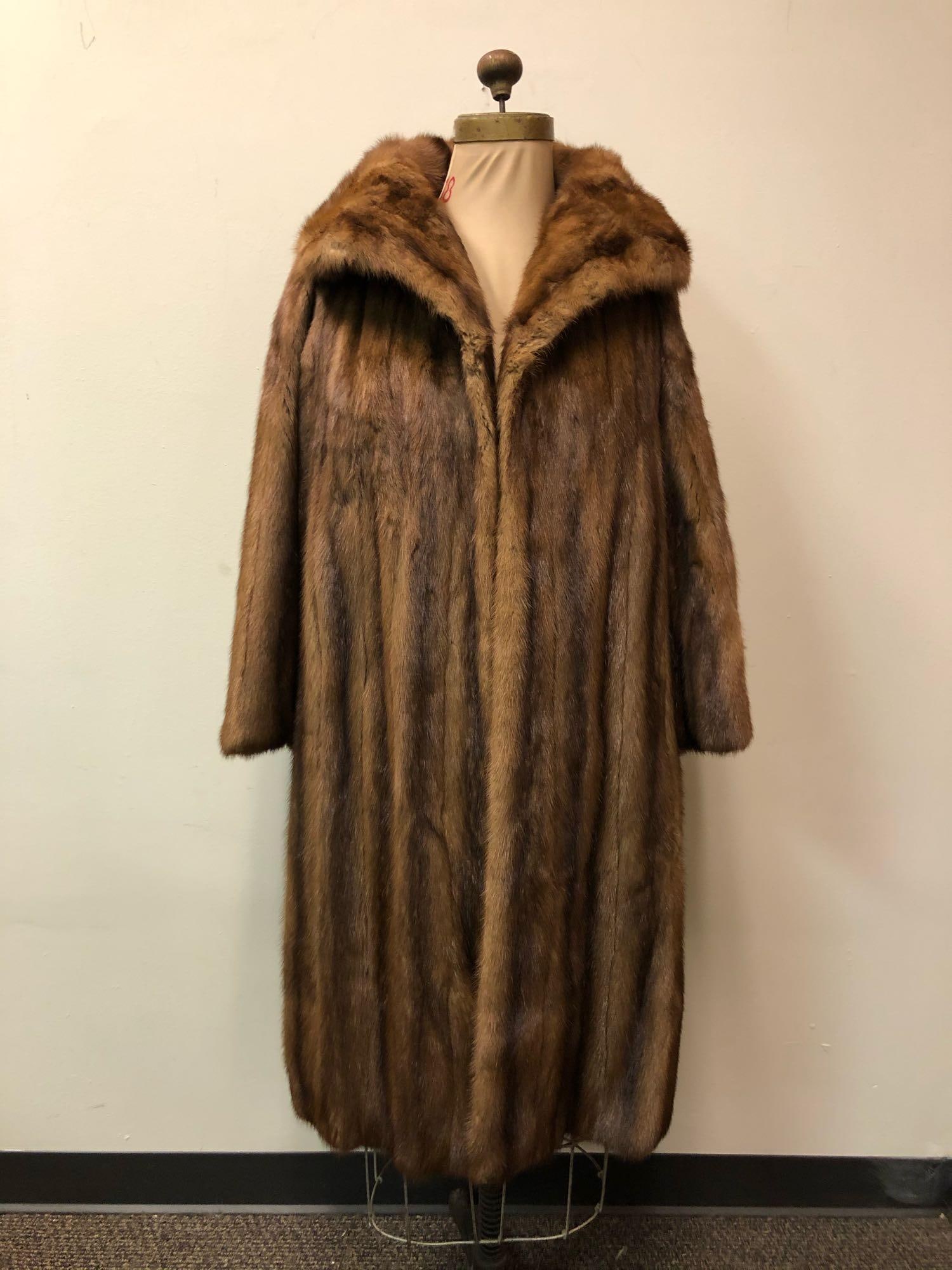 Mink Lunaraine Fur Coat: Mink Lunaraine Fur Coat. This coat features two exterior pockets and no known closures. The interior of the coat is fully lined in a beautiful black satin pattern with an embroidered name "Mary Foster