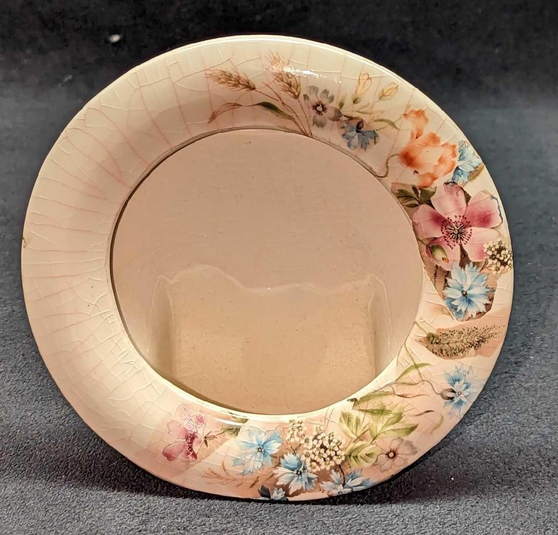 Vintage Ceramic Floral Photo Frame: Vintage Ceramic Floral Photo Frame. Is approx 5" x 1 3/4" x 5" and it weighs 0.33lb. The frame has crazing. Is signed (Evelyn) on the bottom of the frame by its maker.