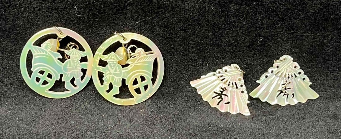 Two Pairs Of Vintage Mother Of Pearl Hand Carved Earrings: This lot contains Two Pairs Of Vintage Mother Of Pearl Hand Carved Earrings. The earrings fit in a small 3 3/4" x 2 1/4" plastic bag. Overall the Mother of pearl earrings are in excellent pre owned co