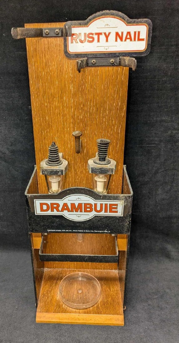 Rare Rusty Nail Drambuie Dispenser Display: Rare Rusty Nail Drambuie Dispenser Display. This is approx 8 1/2" x 8" x 24" and it weighs 8.70 lbs. There are markings on the plastic and surface rust on the metal. Please see the images