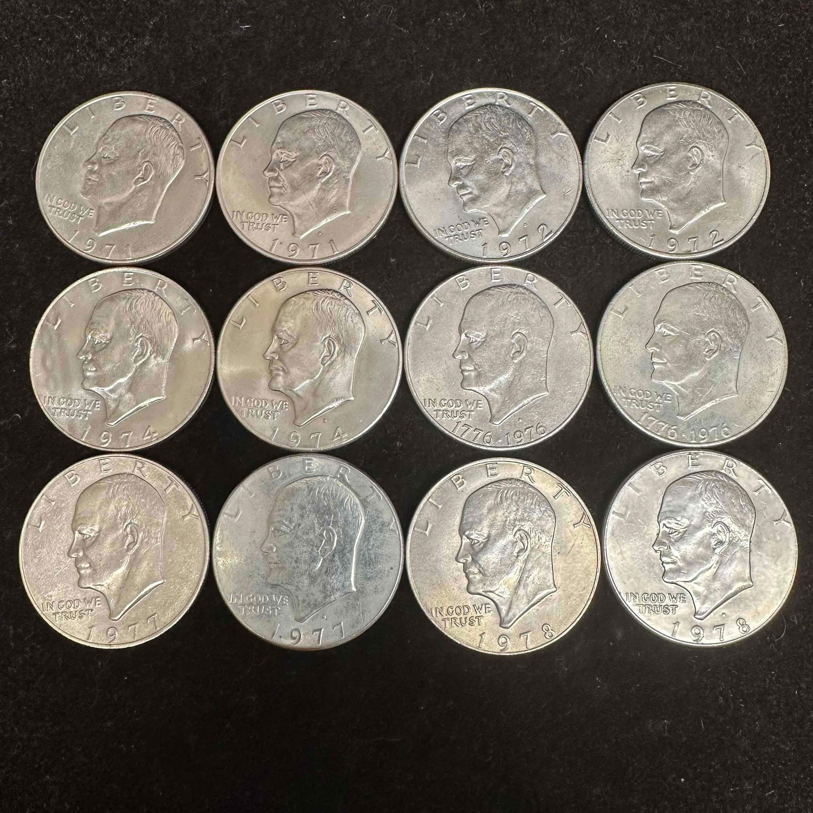 Eisenhower Dollars 1971-1978 Coin Collection 12 Dollar Coins: These coins have been tested and researched to the best of our ability prior to listing. Please view photos, as they are a part of the condition. Two coins are uncirculated with a few coming in a