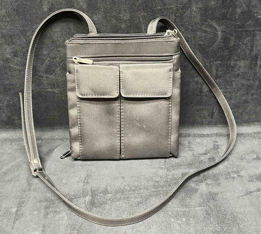 Women's Black Over The Shoulder Bag: This lot contains a Women's Black Over The Shoulder Bag. It is approx 8" x 7" x 1 1/2". Total weight is approx. 0.8lbs. Overall the purse is in good pre owned condition with minor wear from use over