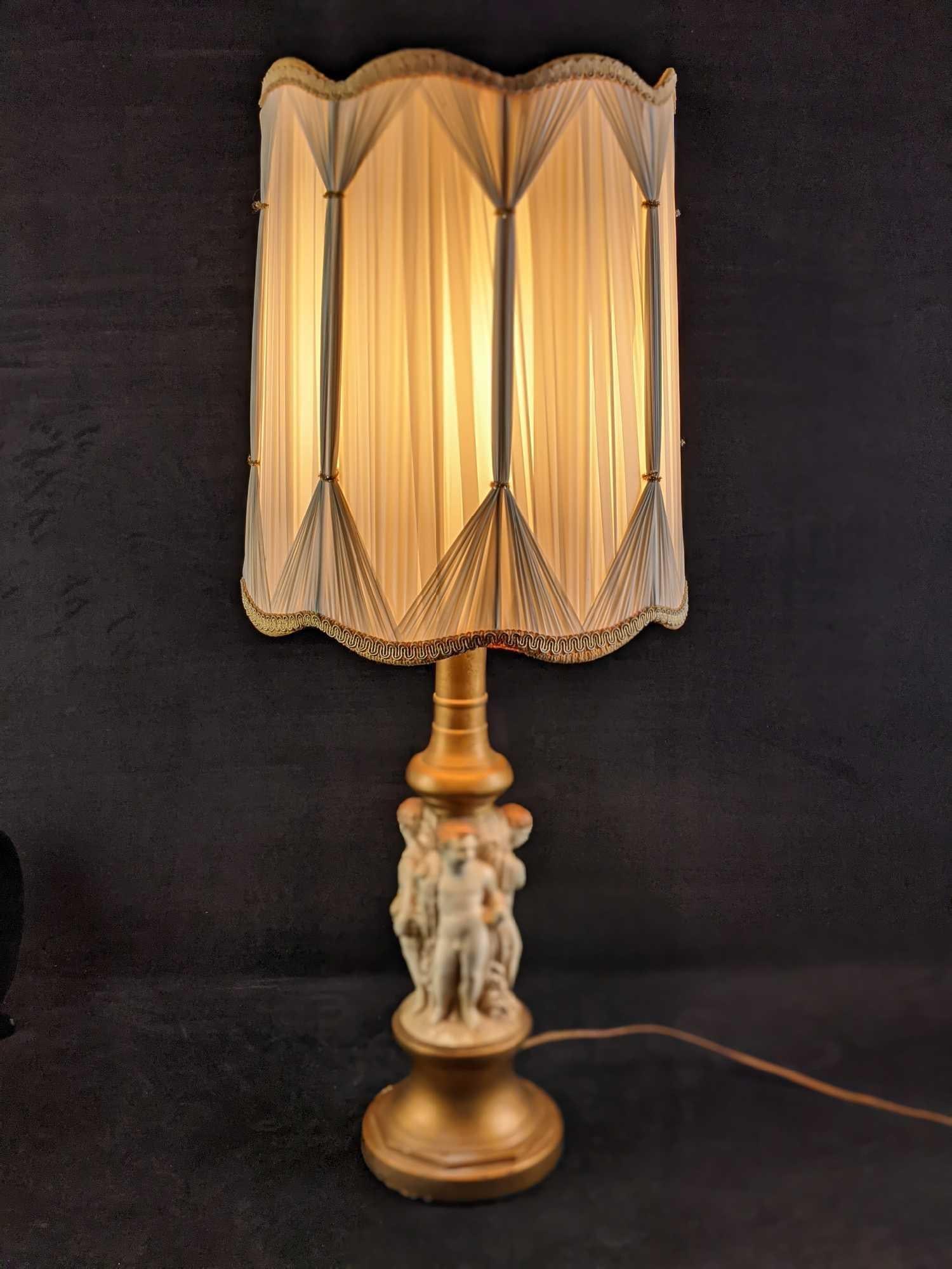 Vintage Chalkware Pieri Lamp Naked Boys Cherub Like: Vintage Chalkware Pieri Lamp from 1964. The lamp's body has hand-painted naked cherub like boys, each holding different items. Lamp is approx 7" x 7" x 35 1/2" and weighs 9lbs. This is counting the la