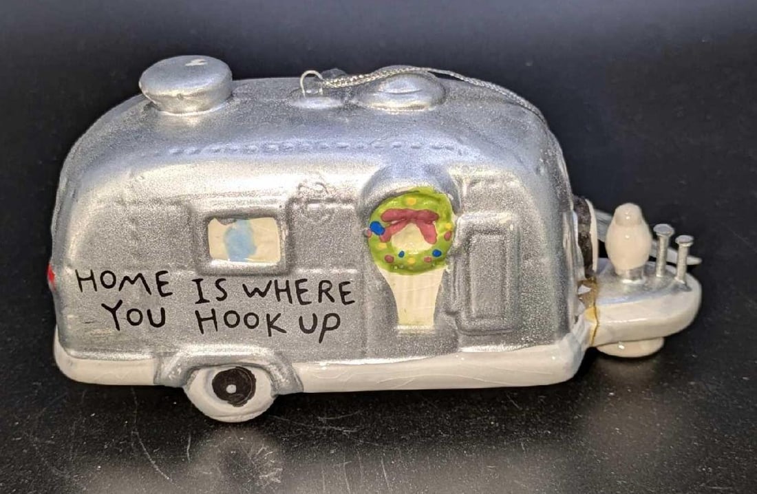 Cape Shore "Home Is Where You Hook Up" Ceramic Ornament.: Cape Shore "Home Is Where You Hook Up" Ceramic Ornament. This is approx 4 5/8" x 2" x 2" and it weighs 0.23lb. The hitch had been broken and repaired. There is still a chip on it a