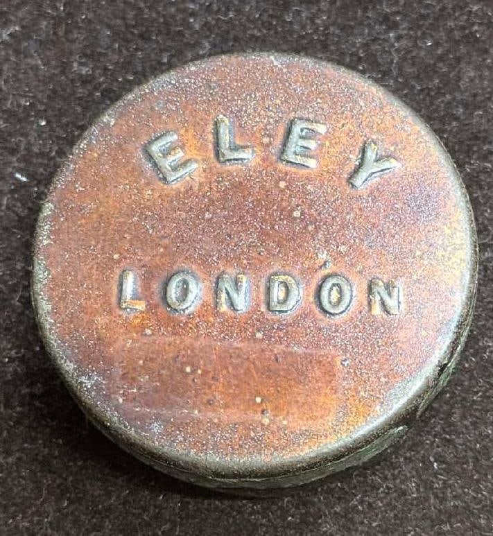 Vintage Eley London Percussion Cap Tin: Vintage Eley London Percussion Cap Tin. Still has some caps inside. The tin is approx 1/2" x 1 1/2" x 1 1/2" and it weighs 0.03lb. The tin has some tarnish. Please see the images as they are part of t