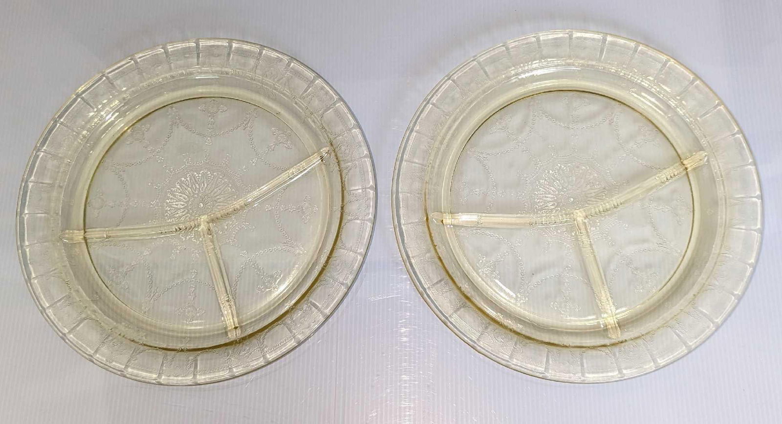 2 Yellow Depression Glass Divided Plates A: 2 Yellow Depression Glass Divided Plates A. Both are approx 10 1/2" x 10 1/2" x 3/4" and together they weigh 3.39lbs. The plates have some signs of light wear.