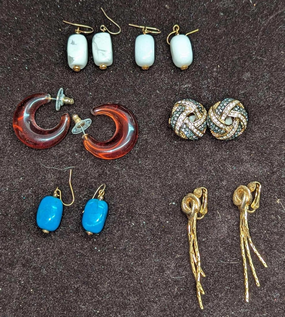 6 Pairs Of Norman Miller Joan Rivers Unmarked Earrings: 6 Pairs Of Norman Miller Joan Rivers Unmarked Earrings. This lot includes: (1) Pair Of Norman Miller Crystal Clip Earrings. (1) Pair Of Joan Rivers Lucite Amber Earrings.(1) Pair Of Gold Tone
