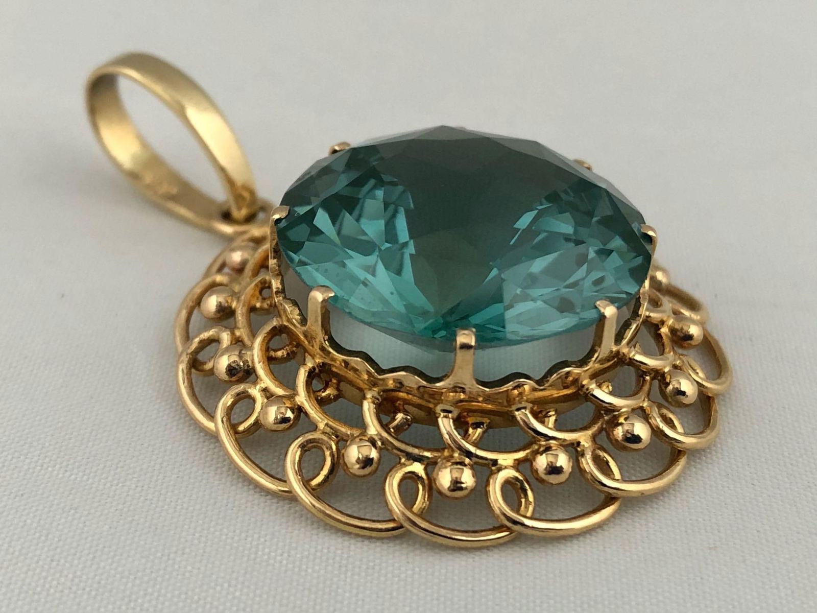 Custom Made European 14K Bezel 22MM Teal Round Faceted CZ Statement Solitaire Medallion Pendant: Custom Made European 14K Bezel 22MM Teal Round Faceted CZ Statement Medallion Pendant.This custom made piece of art is one of a kind featuring a faceted 42 ct 22 mm round teal CZ that is sure to