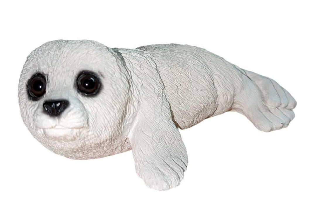 United Design Animal Classics Harp Seal Figurine: United Design Animal Classics Harp Seal Figurine. Is approx 8" x 6" x 3" and it weighs 2.25lbs. Made in 1988. Hand-painted and made of a stone resin. Is in a good, used condition with a chip on the