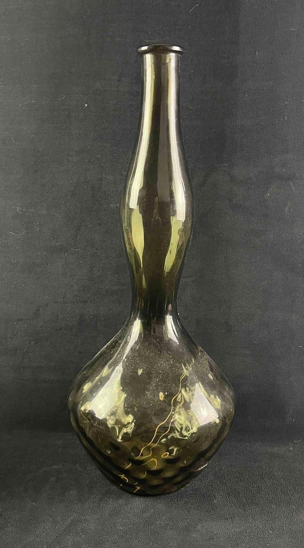 Vintage Blow Glass Black Vase Made In Italy: Vintage Blow Glass Black Vase Made In Italy Pictured is a black hand blow vase. It has a "made in Italy" sticker on it. The vase is in good condition with some slight scratch and chip on the