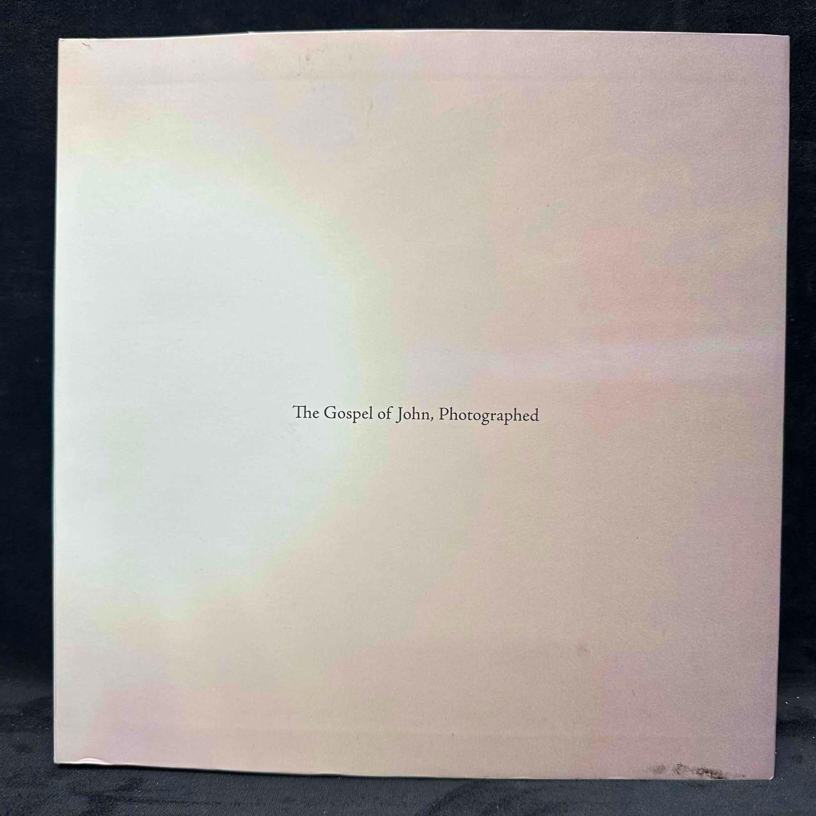 The Gospel of John Photographed by David Kevin Weaver Signed Softcover Book: First edition copy of The Gospel of John, Photographed by David Kevin Weaver, published by Four Line Media. This large-format softcover pairs the full King James text of the Gospel of John with Weaver