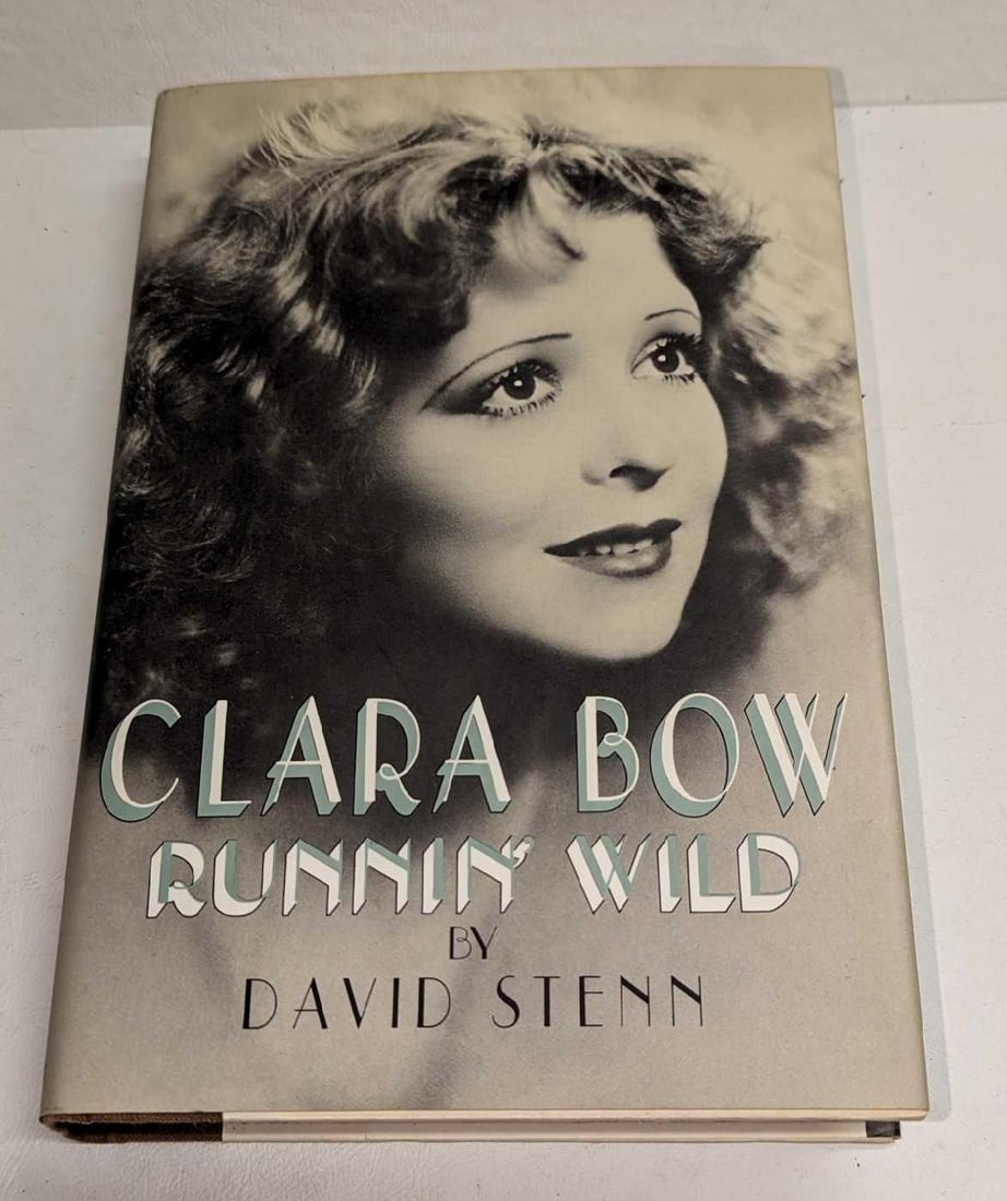 David Stenn Signed Clara Bow Runnin' Wild Hardcover: David Stenn Signed Clara Bow Runnin' Wild Hardcover. This was published by Doubleday (New York) in 1988. First Edition. The hardcover book is approx 6 1/2" x 1" x 9 3/4" and it weighs