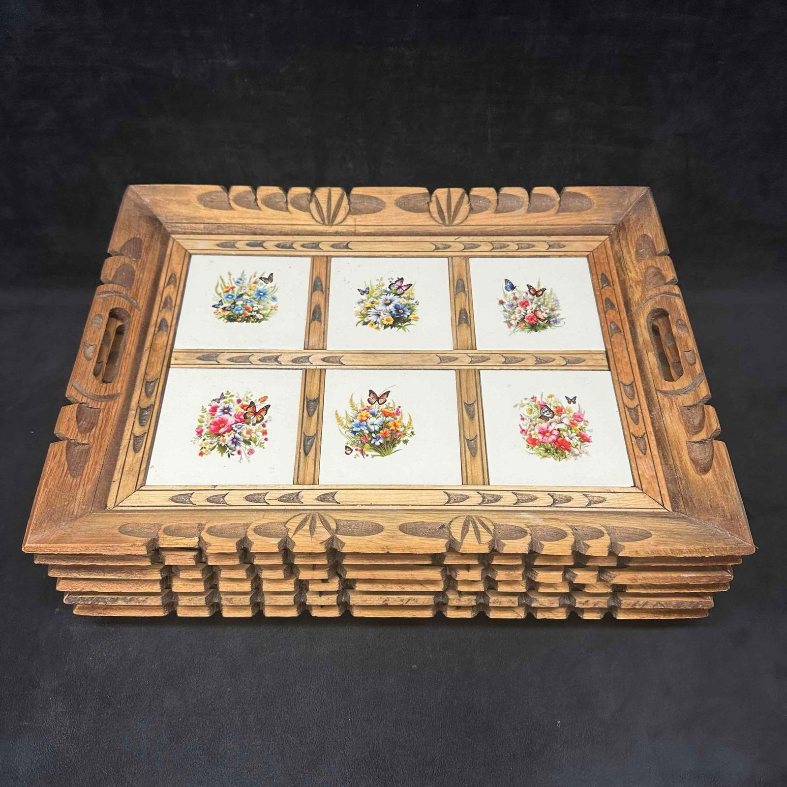 6 Vintage Wooden Serving Trays with Tile Inlays Sticker Floral Butterflies and Bird Motifs: Set of six vintage hand carved wooden serving trays featuring colorful tile inlays with sticker floral bouquets and vibrant bird and butterfly designs. Each tray has a hand-carved wooden frame with ha