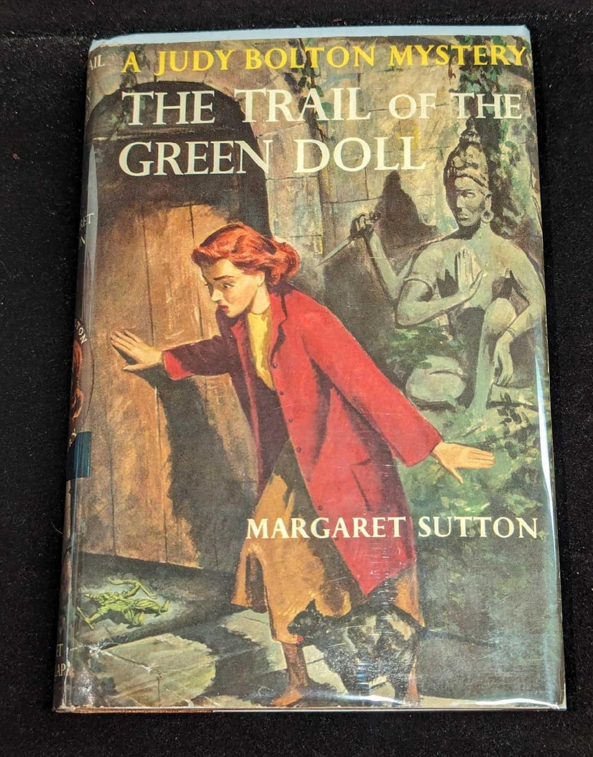 1st Ed Judy Bolton The Trail Of The Green Doll HC #27: 1st Ed Judy Bolton The Trail Of The Green Doll HC #27. "A Judy Bolton Mystery - The Trail Of The Green Doll". By Margaret Sutton (The pen name of Rachel Beebe) was published by Grosset & Dunlap (New