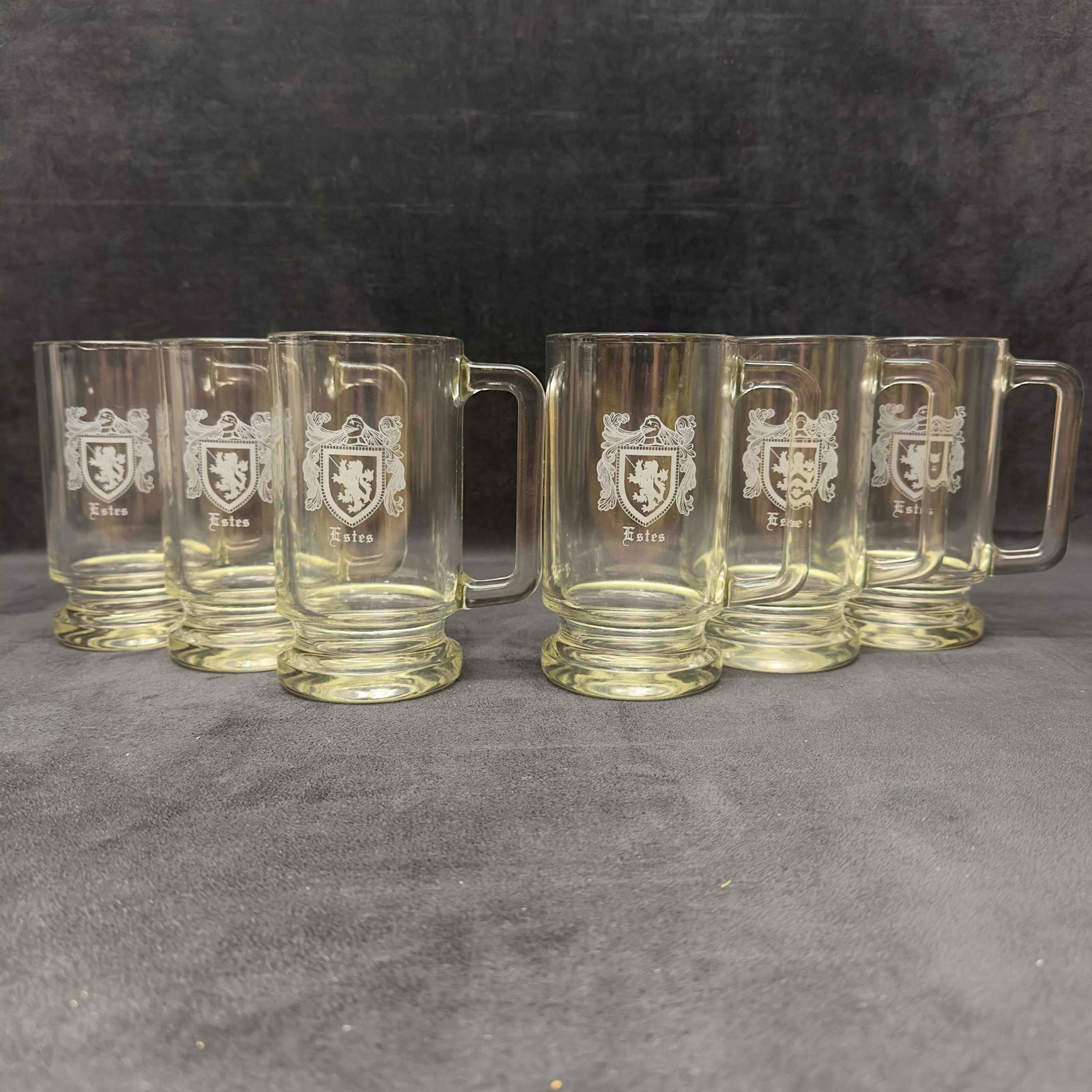 Coat of Arms Family Crest Beer Mug Stein Set Lot of Six 6 Estes: Coat of Arms Family Crest Beer Mug Stein Set Lot of Six 6 Estes. Glass beer mug stein set featuring a coat of arms and/or family crest representing Estes family. Light small chip in one glass mug on