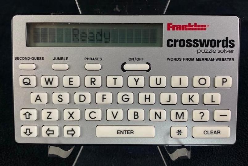 Franklin Merriam-Webster Crossword Solver: Franklin Merriam-Webster Crossword Solver Assists in solving crosswords puzzles. Is currently working, and comes with leather pouch/case. Approximate size: 4.5" x 2.75" x 0.5" 